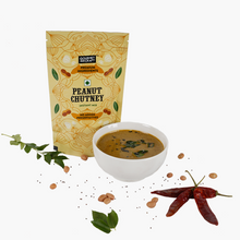 Load image into Gallery viewer, A pack of instant peanut chutney with company name on it kept ahead of white background with some chutney ingredients and a bowl of chutney are kept aside. 
