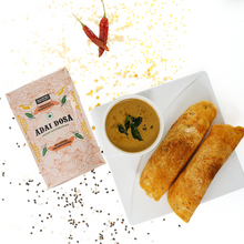 Load image into Gallery viewer, A pack of multigrain adai dosa with company name on it kept beside a platter having dosas and chutney in it with some dry red chillis and muster seeds aside.
